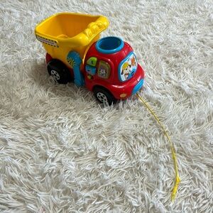 VTech Drop and Go Dump Truck- pull toy and plays songs. Cute baby/ toddler toy